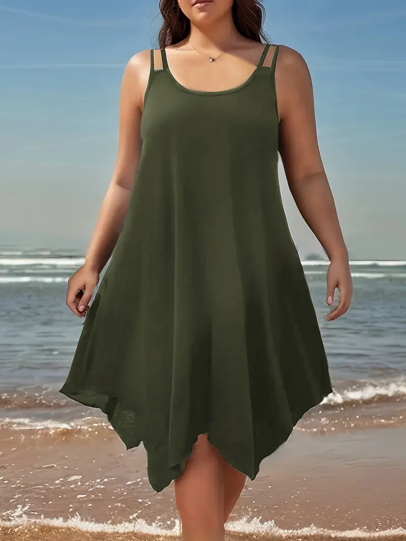 Woman wearing a green dress on a beach