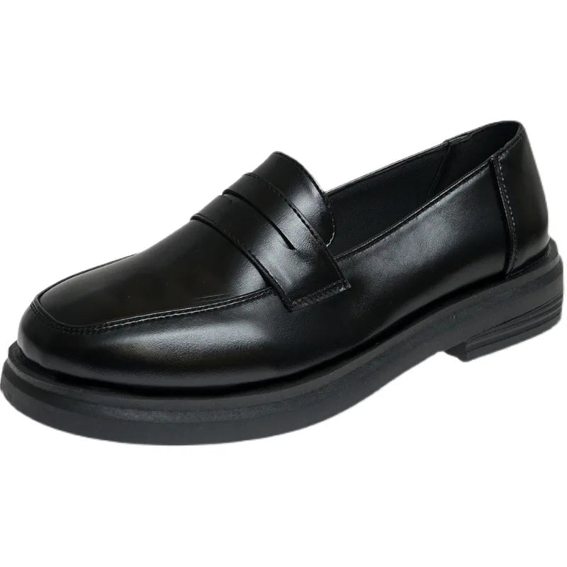 Black leather loafer shoe on a white background