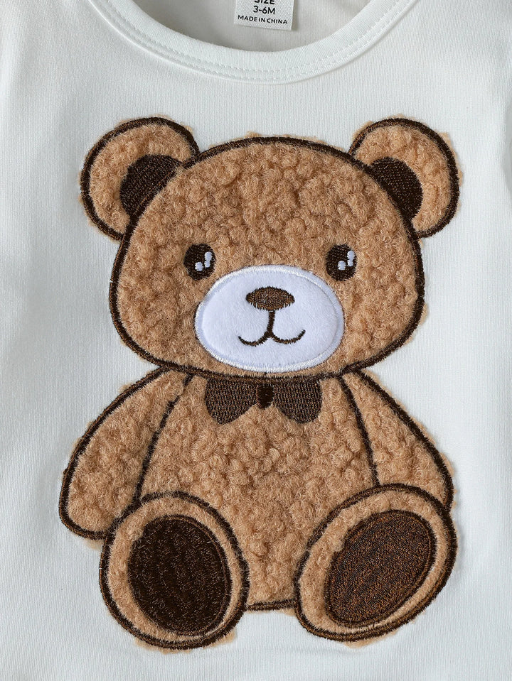 Brown teddy bear patch on a white background