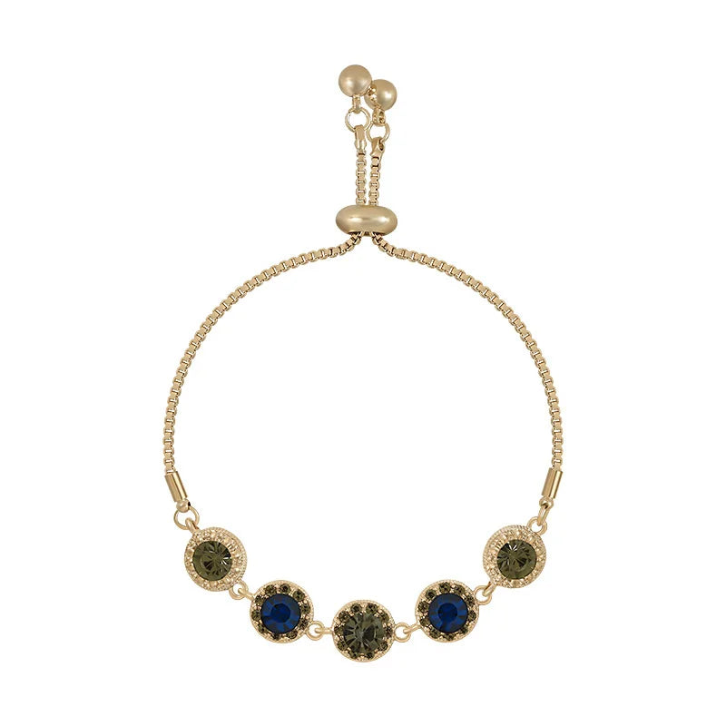 Gold-tone chain bracelet with round green and blue zircon-like stones