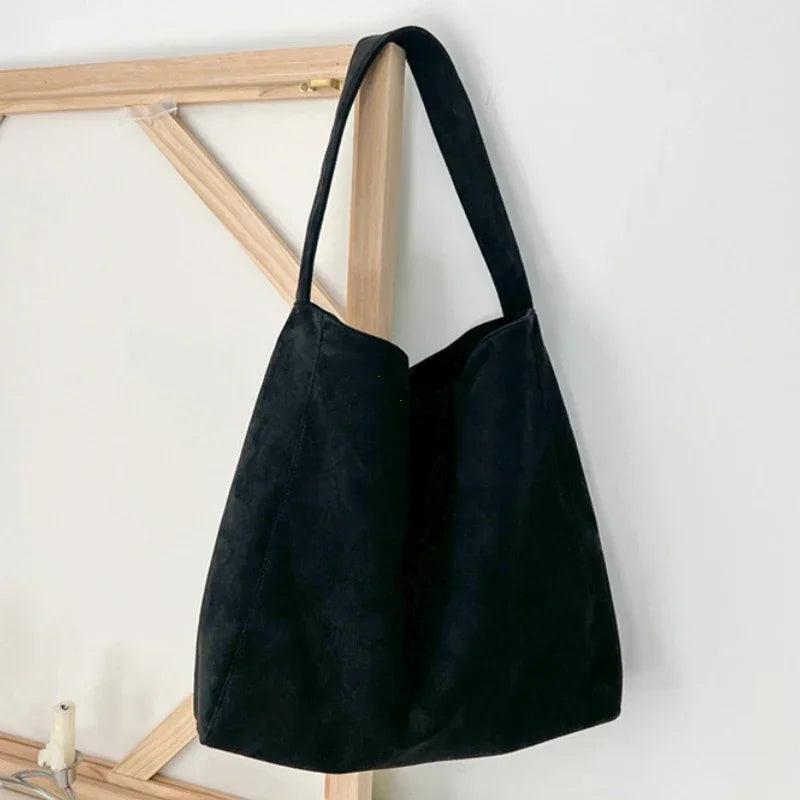 Black suede-look underarm tote bag with long handles and open top