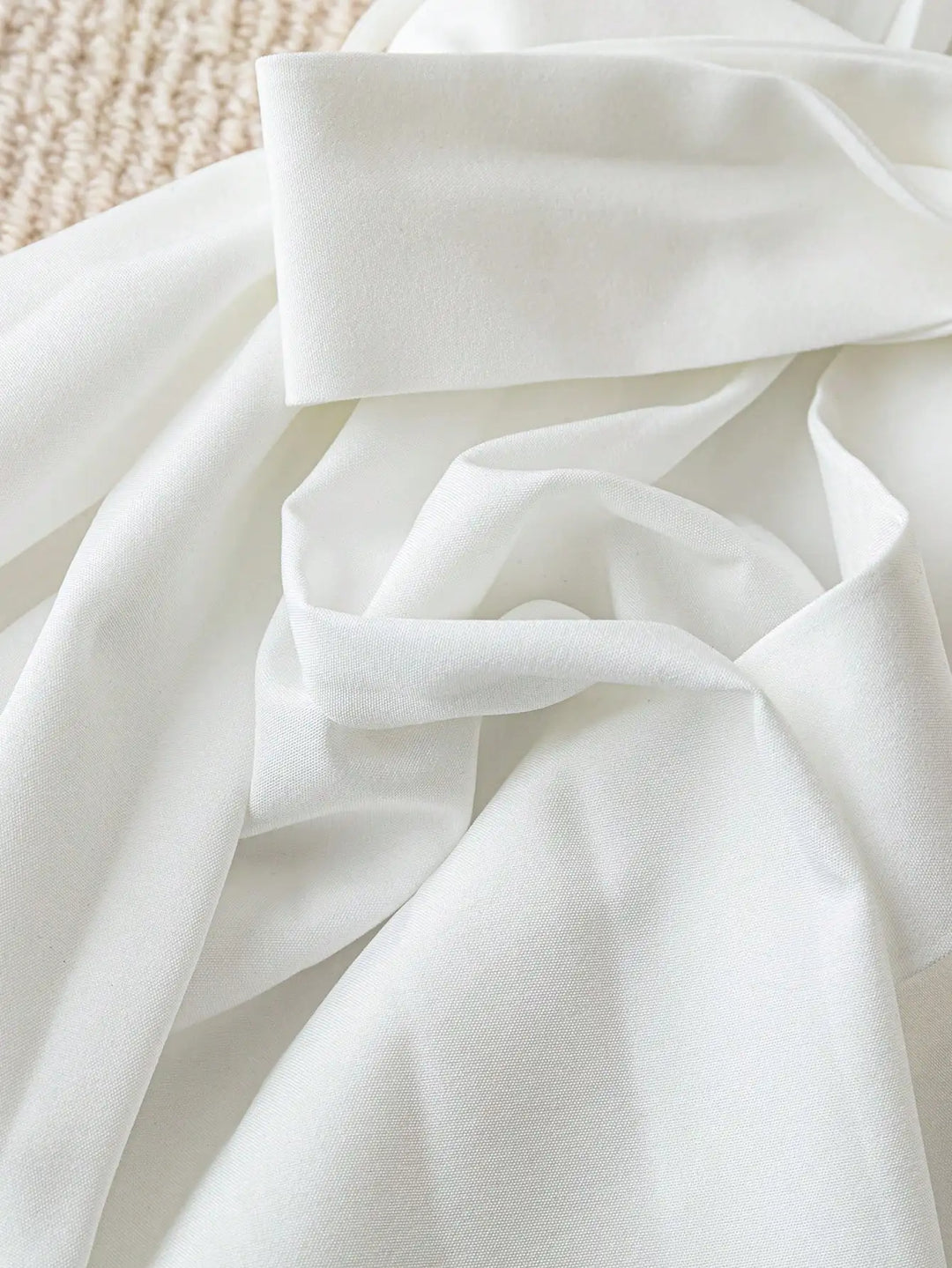 White shirt with tied waist ribbon and pleated fabric detail