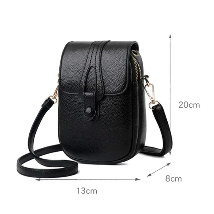 Black small crossbody handbag with flap closure and adjustable shoulder strap