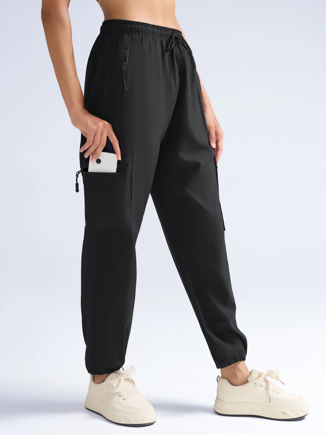 Women's Black Cargo Joggers Showing A Phone In The Thigh Pocket
