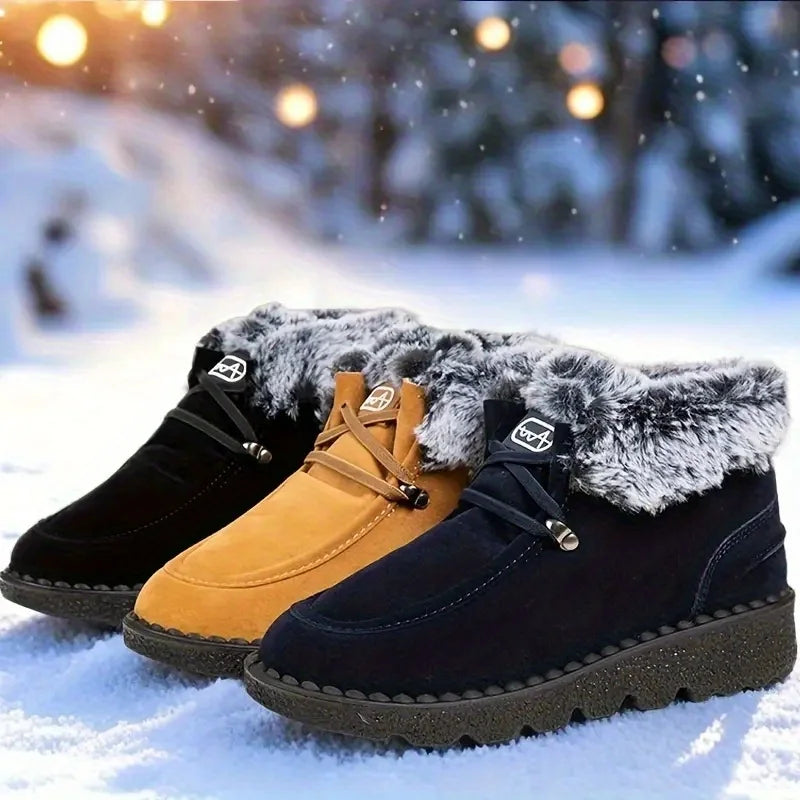 Pair of women's winter snow boots in tan and black with faux-fur cuffs