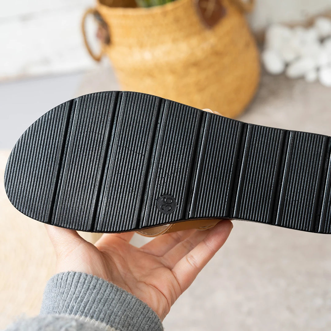 Camel sandal outsole with textured ribbed rubber tread