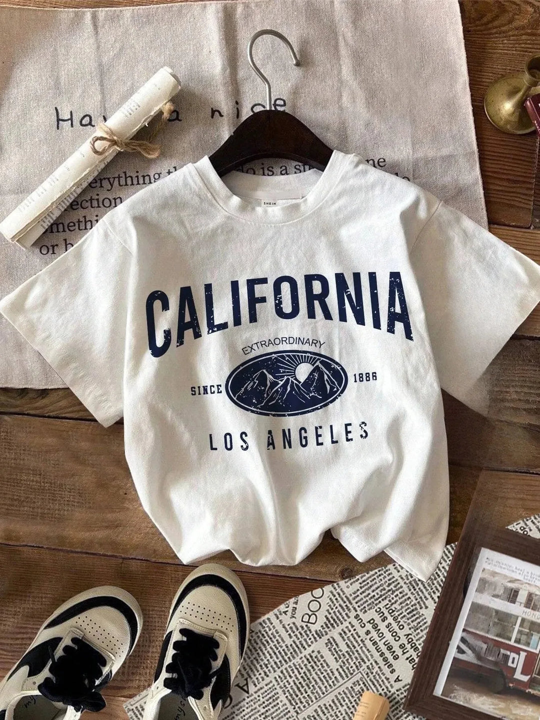 White plus size graphic tee with CALIFORNIA Los Angeles emblem front print