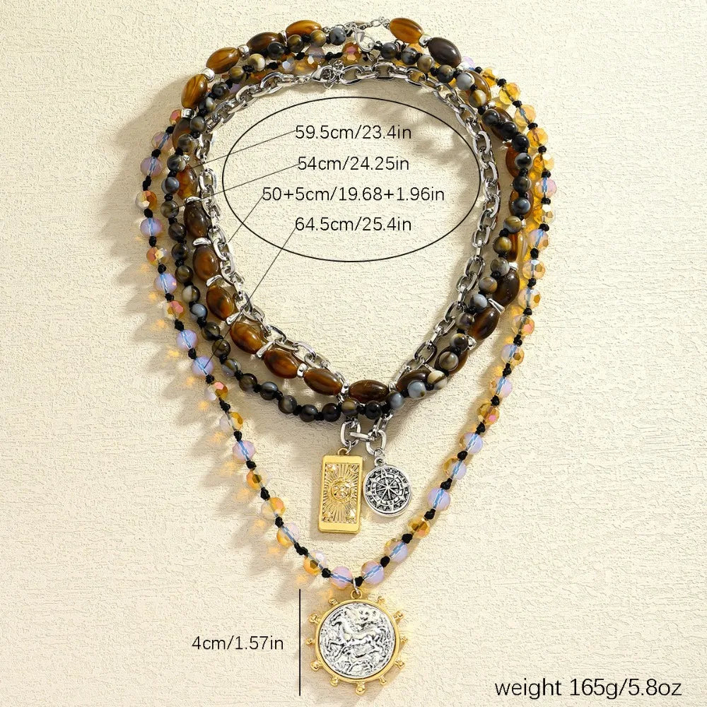 Three-strand beaded necklace with tiger-eye, black and iridescent beads; square and coin charms