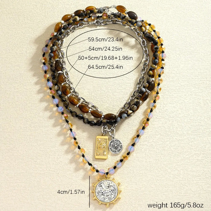 Three-strand beaded necklace with tiger-eye, black and iridescent beads; square and coin charms