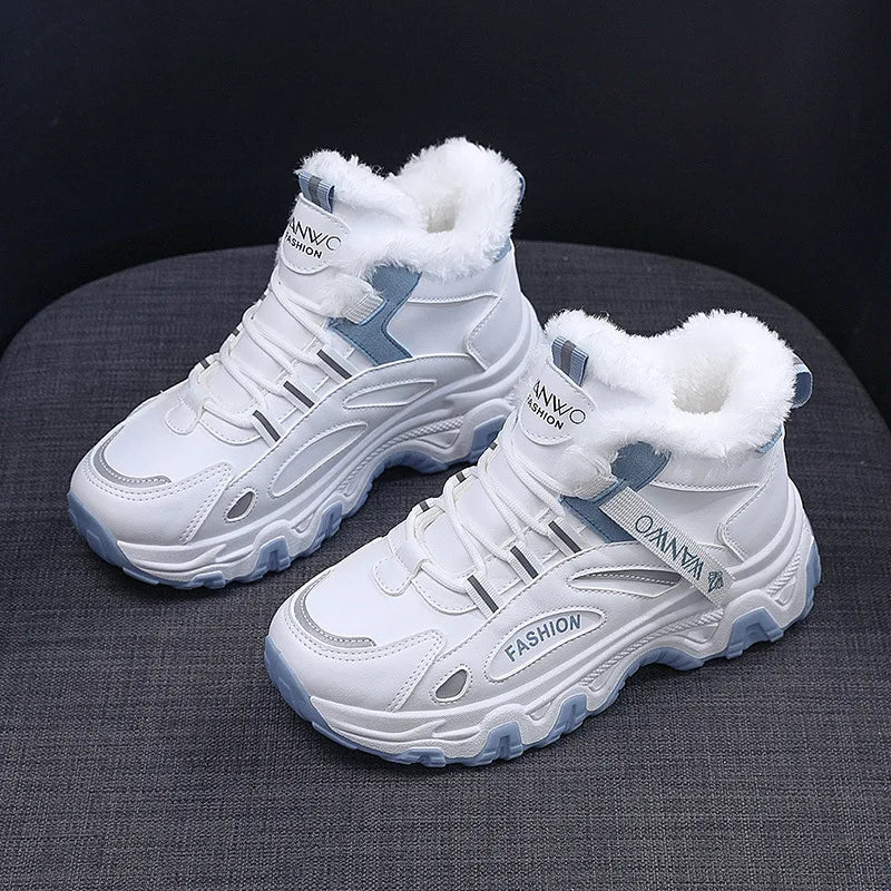 White high-top sneakers with blue accents on a dark surface
