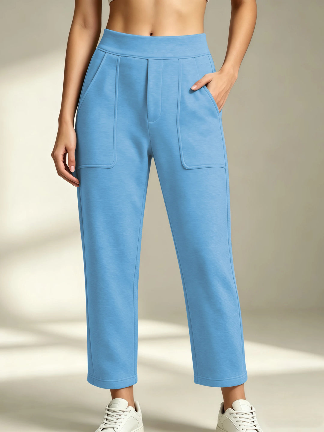 Women's sky blue straight-leg sweatpants with an elastic waist and front patch pockets