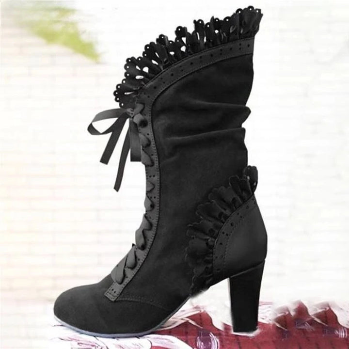 Black mid-calf lace-up high-heel boots with ruffled cuff and front lace detail