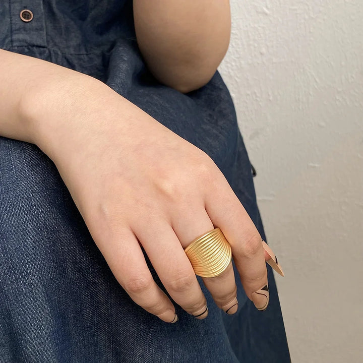 Gold ribbed dome statement ring with adjustable open band