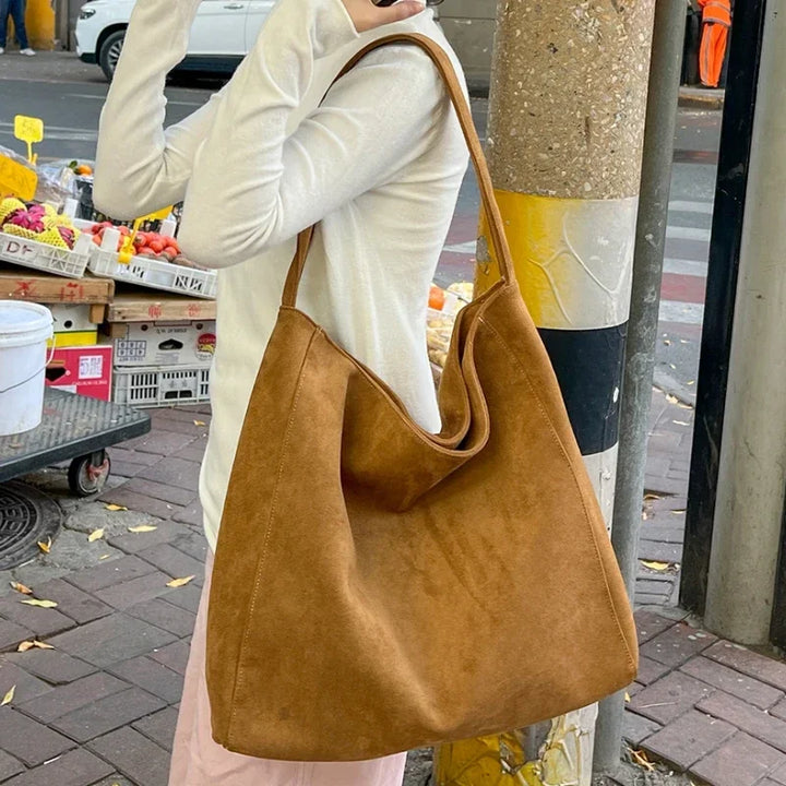 Brown suede-look underarm tote bag with open top and wide short handles