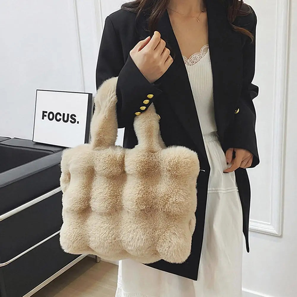 Beige faux fur bucket handbag with short handles and button detail