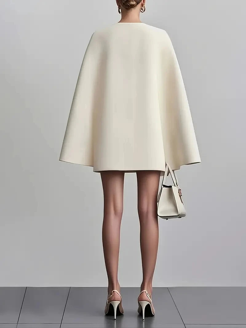 Beige shawl cloak dress suit, back view with cape-like sleeves
