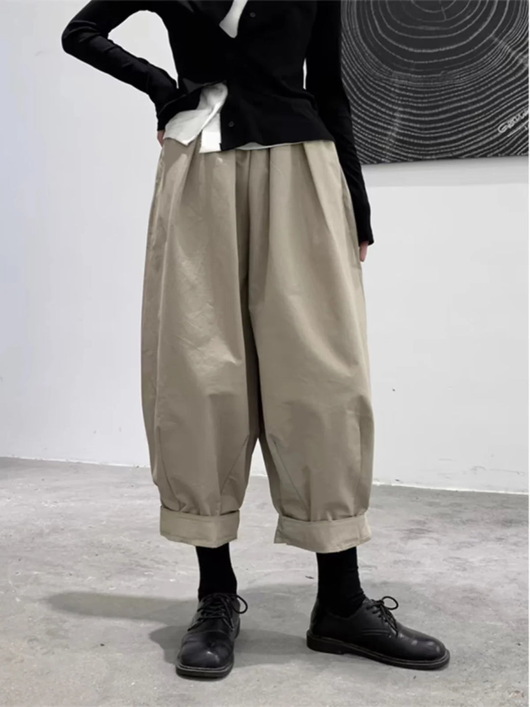Loose-fit cabbage pants in light khaki, baggy wide leg with cuffed hems