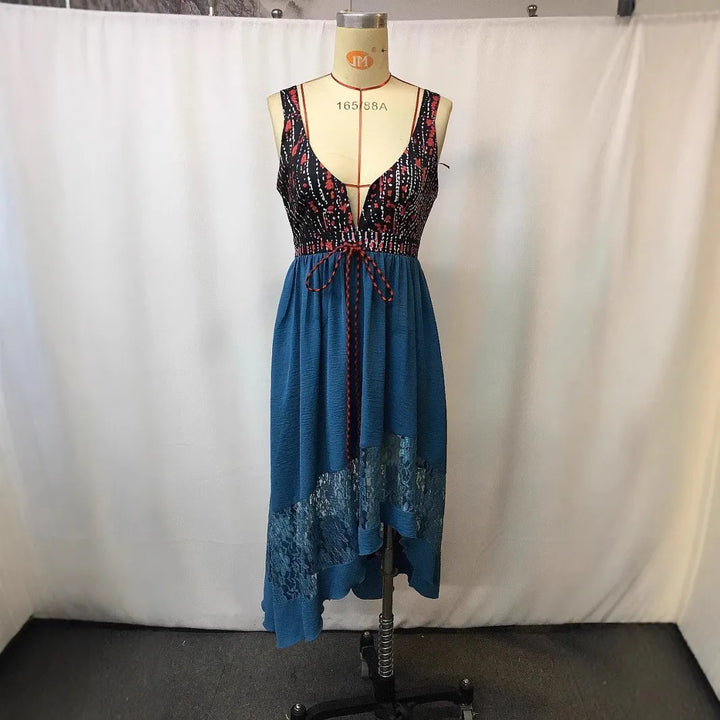 Peacock blue sleeveless V-neck dress with patterned black bodice and lace banded hem