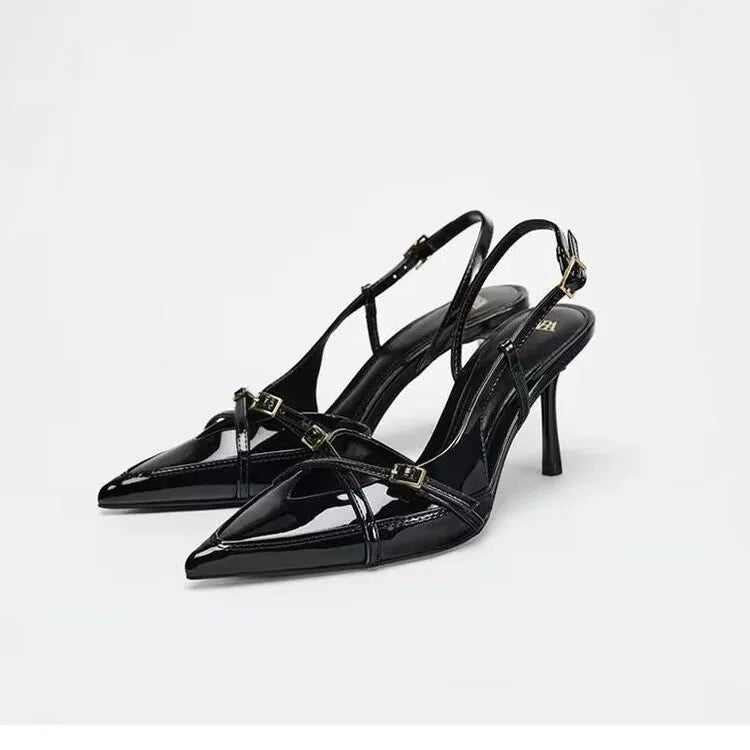 Pair of black open cross-strap pointed-toe slingback high heels with slim stiletto