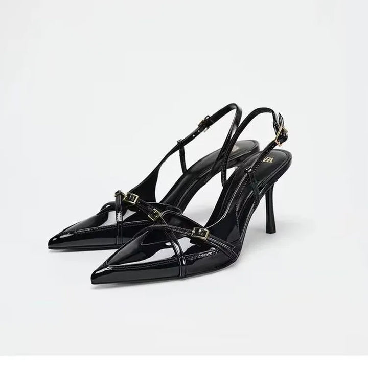 Pair of black open cross-strap pointed-toe slingback high heels with slim stiletto