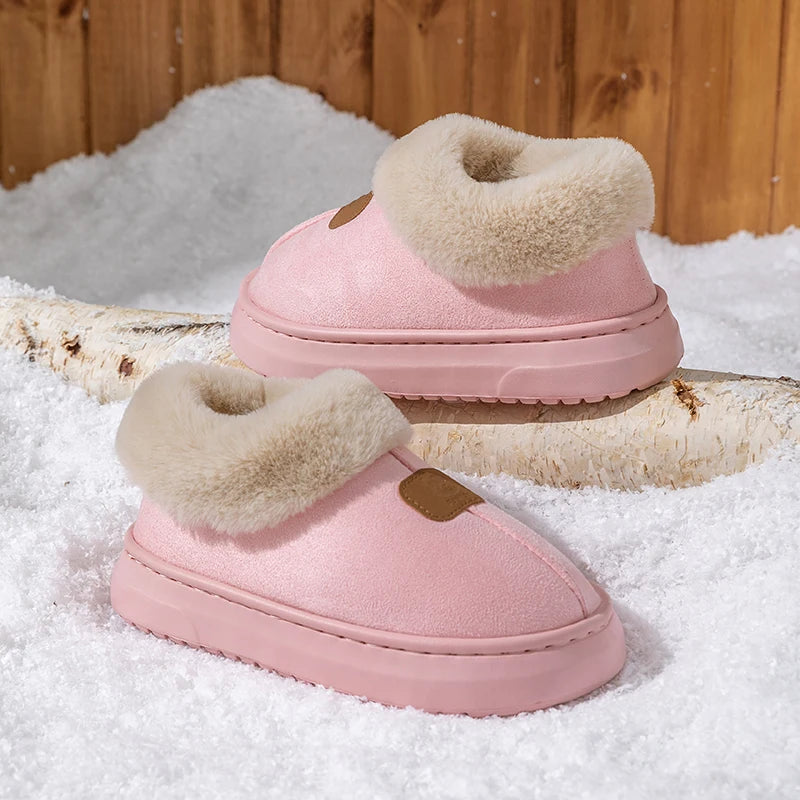 Women’s pink winter snow boots with plush sherpa trim, slip-on design, cushioned sole