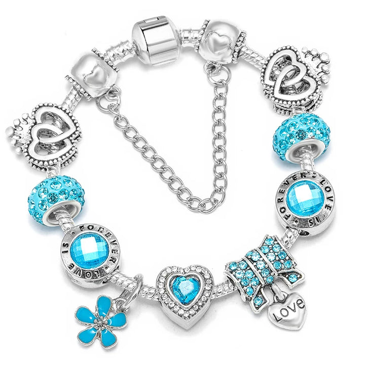 Blue crystal charm bracelet with heart and flower bead details