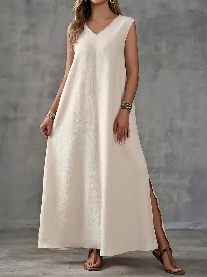 Beige Maxi-Kleid ohne Ärmel mit V-Ausschnitt vorn und Schlitz am Saum