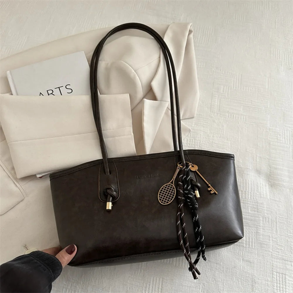 Large PU leather crossbody tote handbag, black with double handles and side tassels