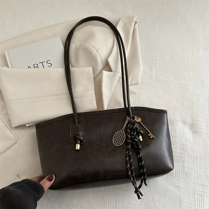 Large PU leather crossbody tote handbag, black with double handles and side tassels