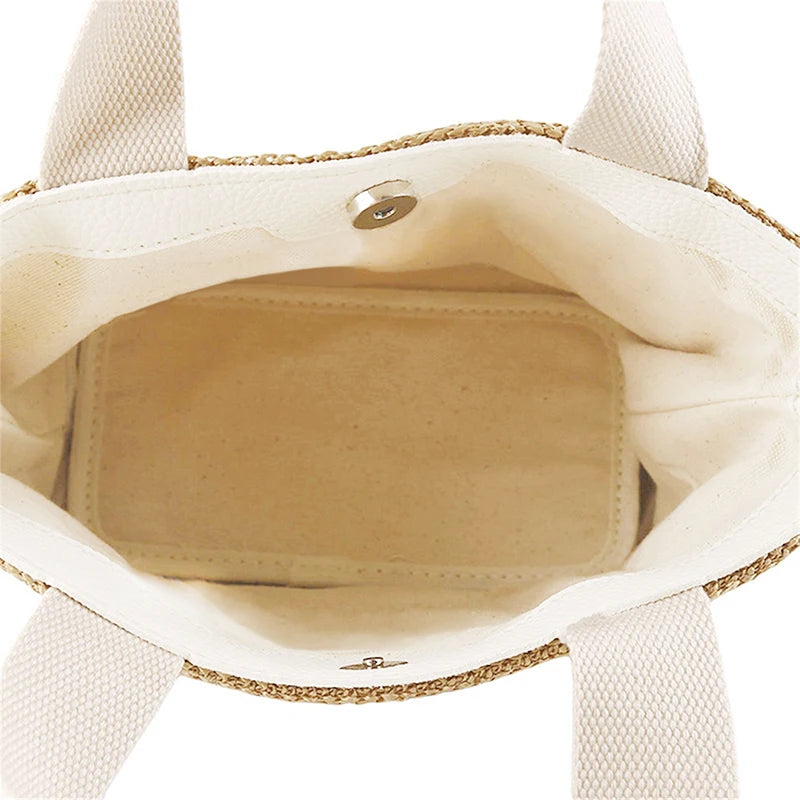 Beige woven bucket handbag interior with light fabric lining and small snap button