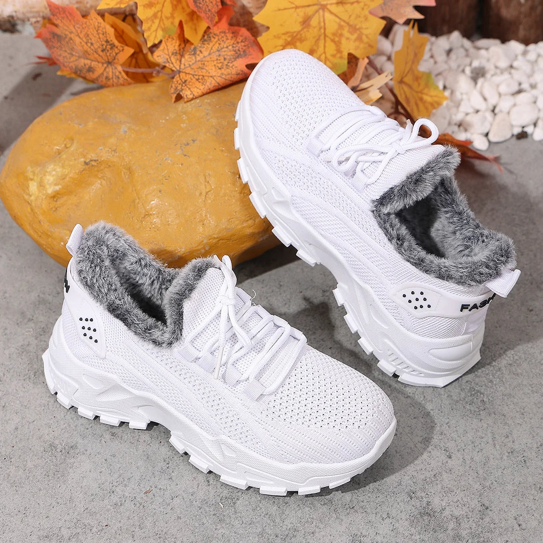Women’s white knit lace-up snow sneakers with plush gray lining and rugged tread sole