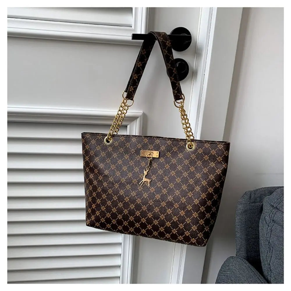 Large patterned bucket tote bag with chain handles and top clasp, dark brown