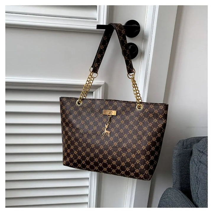 Large patterned bucket tote bag with chain handles and top clasp, dark brown