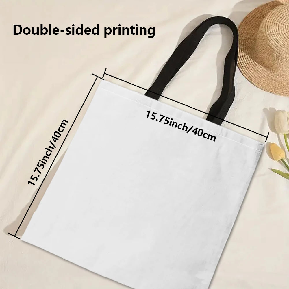 White tote bag with black shoulder straps, laid flat with open top