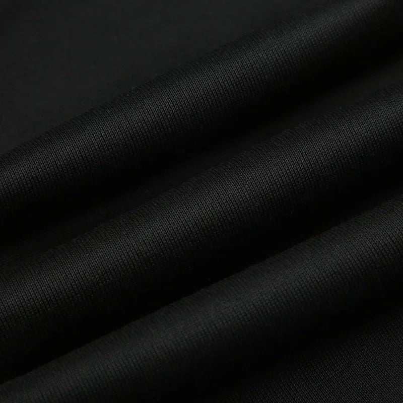 Women's slim-fit bootcut dress pants fabric, black knit close-up