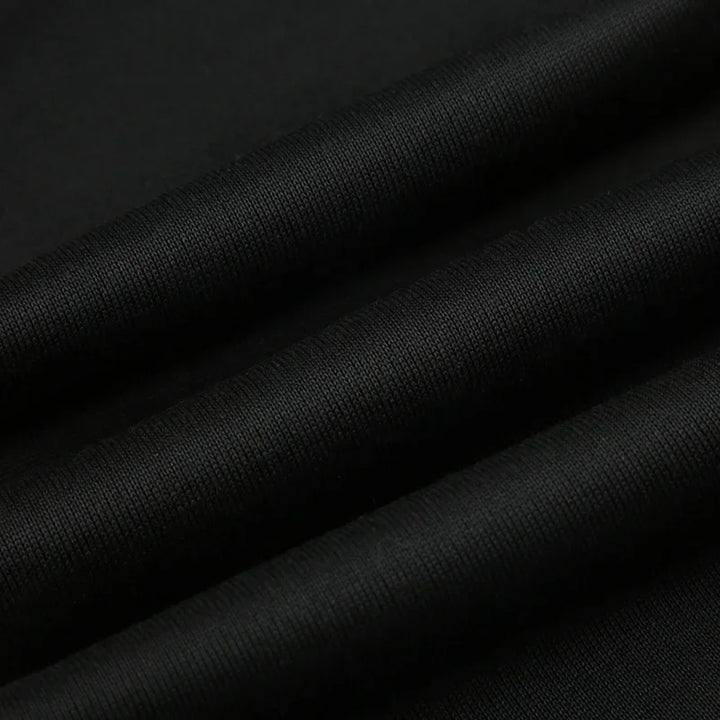 Women's slim-fit bootcut dress pants fabric, black knit close-up