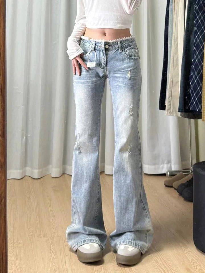 Light blue plus-size straight-leg jeans with mid-rise waist; front button and belt loops