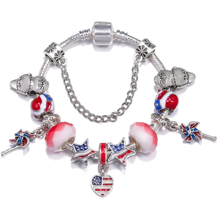 Silver charm bracelet with red, white, and blue star and heart charms and white spacer beads