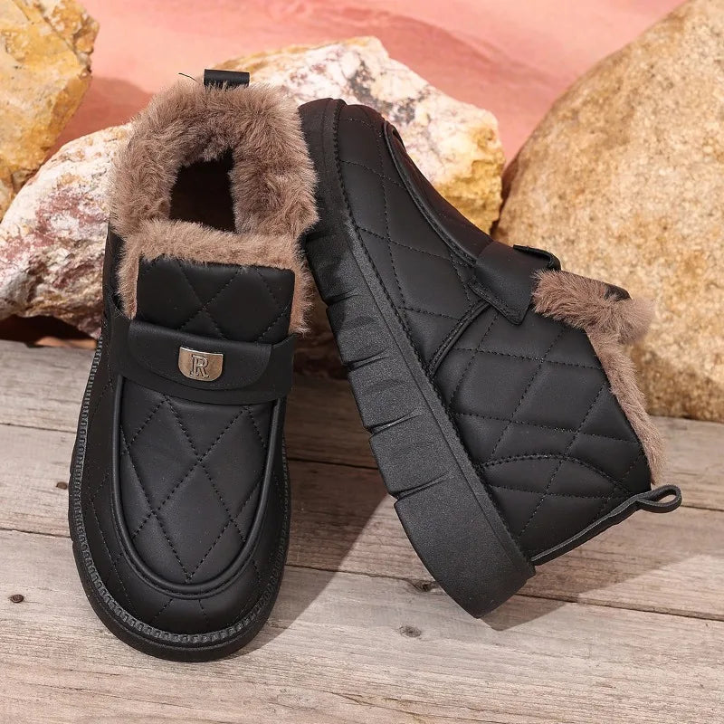 Black quilted ankle boots with faux fur lining and hook-loop strap detail