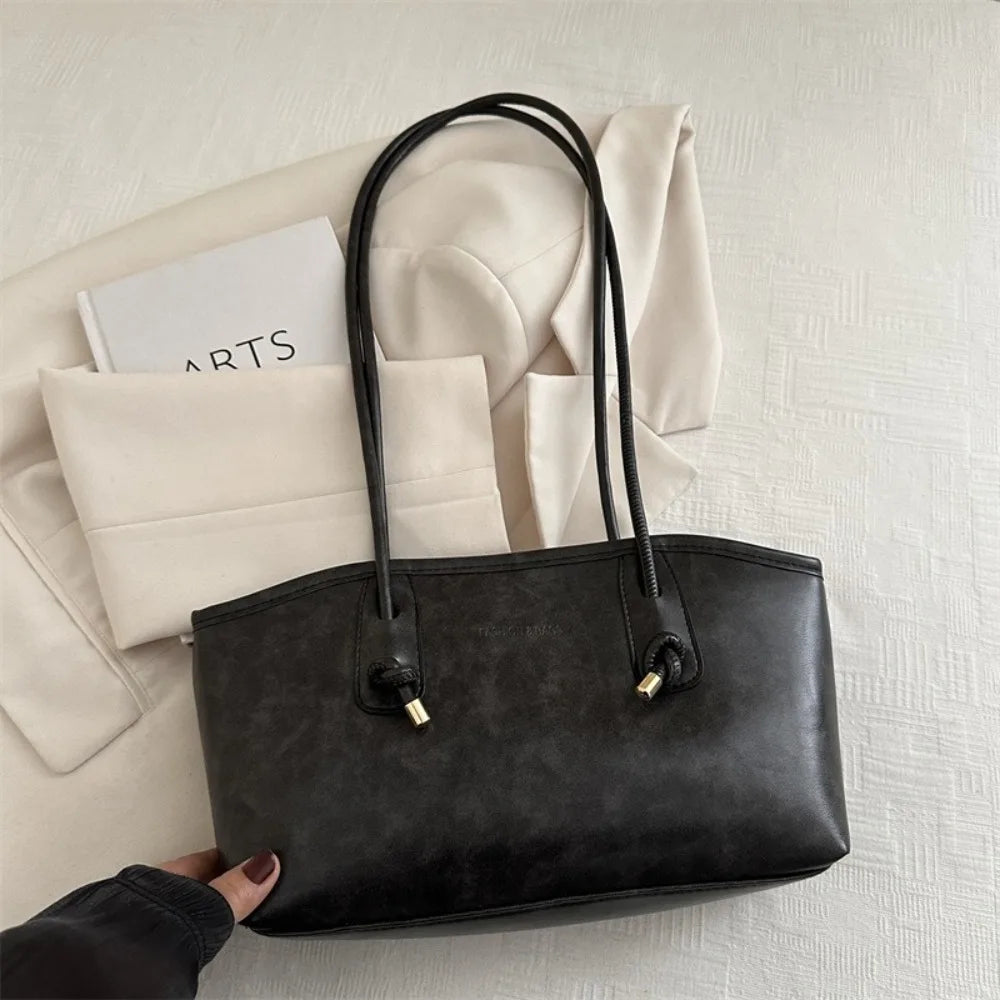 Large PU leather crossbody tote handbag, black with two gold-tone D-ring pulls