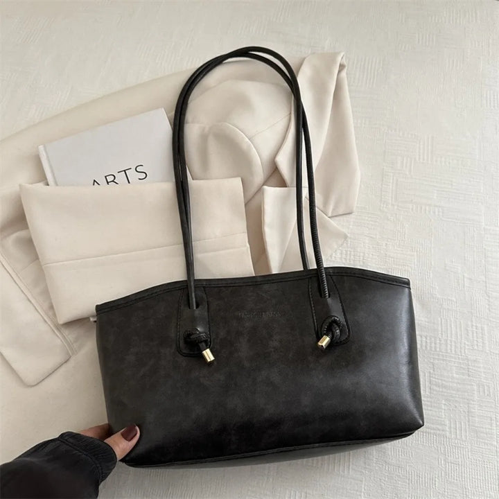 Large PU leather crossbody tote handbag, black with two gold-tone D-ring pulls