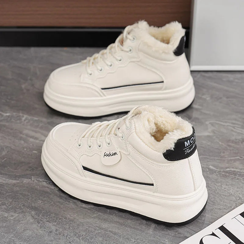 White lace-up platform sneakers with plush fur lining and dark heel patch detail