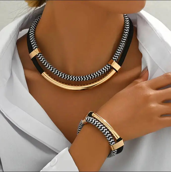 Necklace and bracelet set with black and white pattern on a mannequin