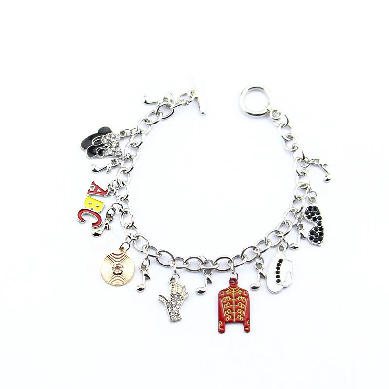 Silver-tone charm link bracelet with ABC letters, red jacket, coin charm, hand, guitar, heart