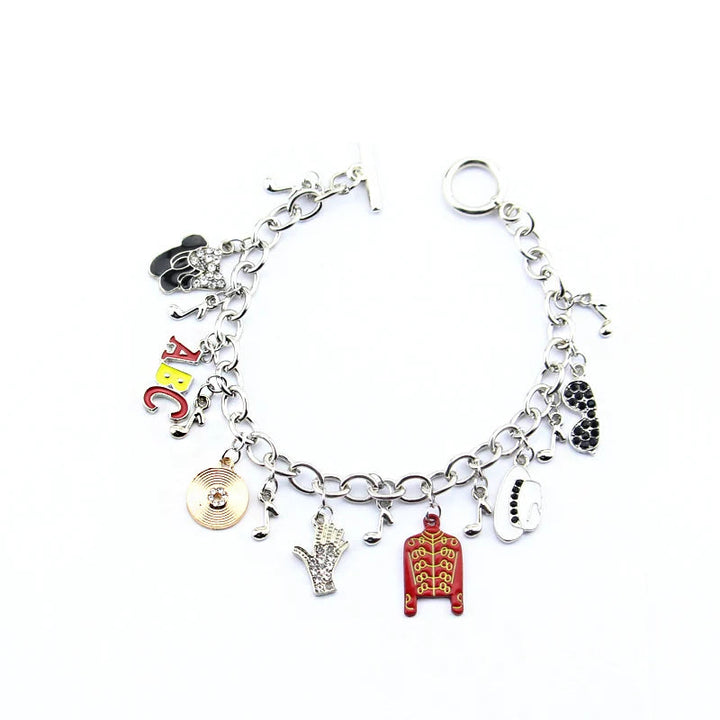 Silver-tone charm link bracelet with ABC letters, red jacket, coin charm, hand, guitar, heart