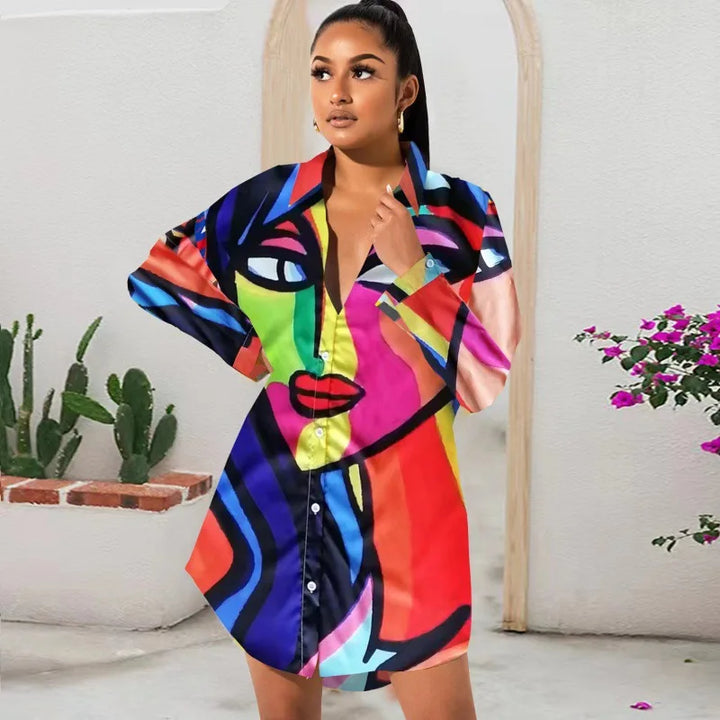 Woman wearing a colorful dress with abstract patterns in a room with plants.