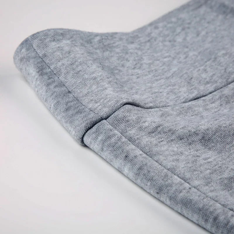 Gray fabric close-up with waistband seam detail on dress pants