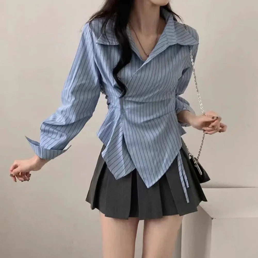 Light blue striped long-sleeve slim blouse with pointed collar and wrap front detail