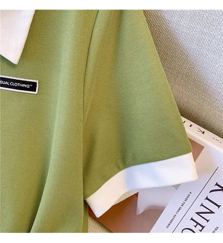 Green polo dress skirt with pleats and white hem facing