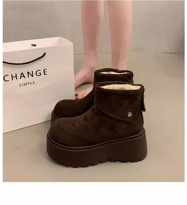 Brown wool-lined ankle boots with button strap and thick lug sole